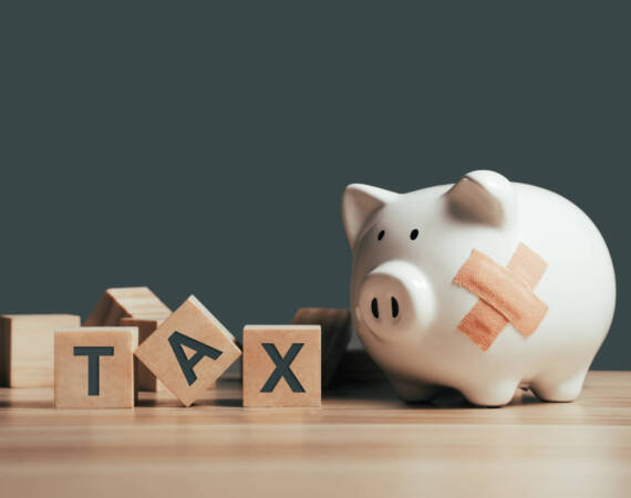 Tax on wooden blocks. Business and tax concept. Financial calculation, tax, accounting, statistics and analytical research concept.